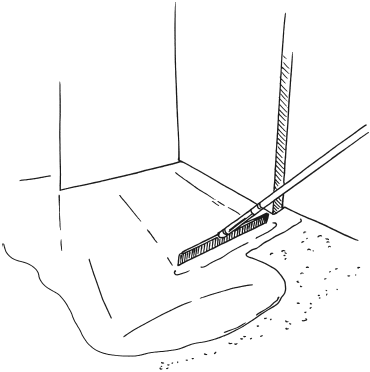 Рис. 32. Выравнивание нанесенного слоя литой гидроизоляции